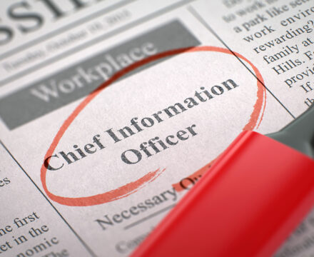 A newspaper job ad with Chief Information Officer circled in red marker, next to a red highlighter, under the Workplace section.